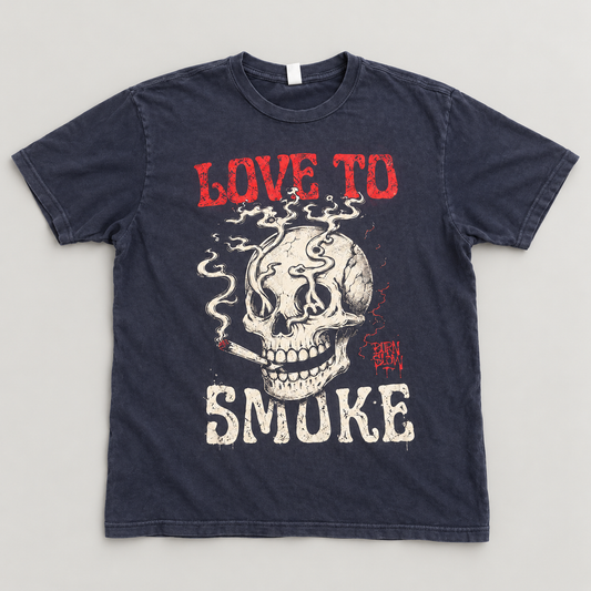 Love to Smoke Tee

For those who wear what they love. The Love to Smoke Tee features a smoking skull framed by bold red and cream lettering, with distressed details that give the graphic a worn-in, vintage feel.